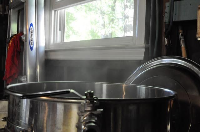 Steamy brew kettle next to the open window.