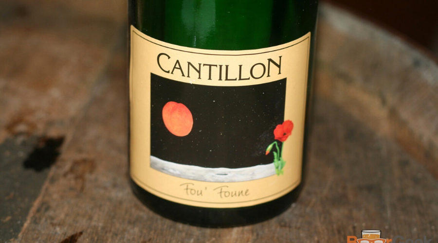 a bottle of cantillon fou foune on a barrel